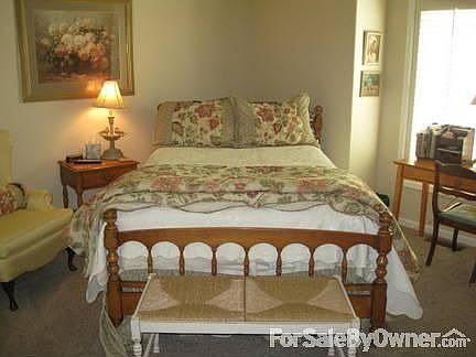 Guest Bedroom : Ten foot ceilings with plantation shutters throughout.