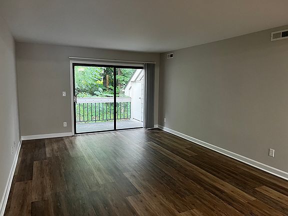Living room with sliding glass doors to the balcony.