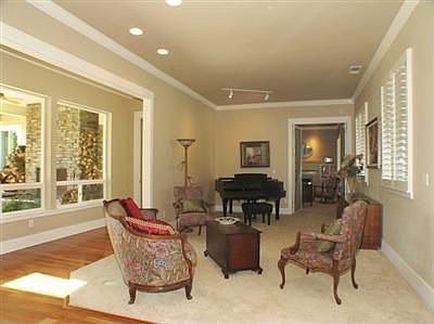 Formal Living Room overlooks Outdoor Fireplace & Pool