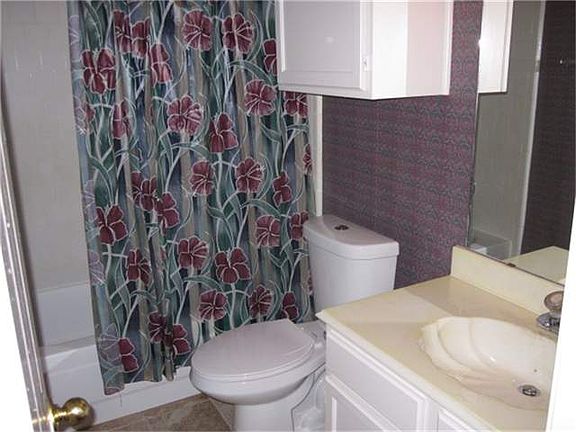 Hall bath with new toilet and refreshed walls