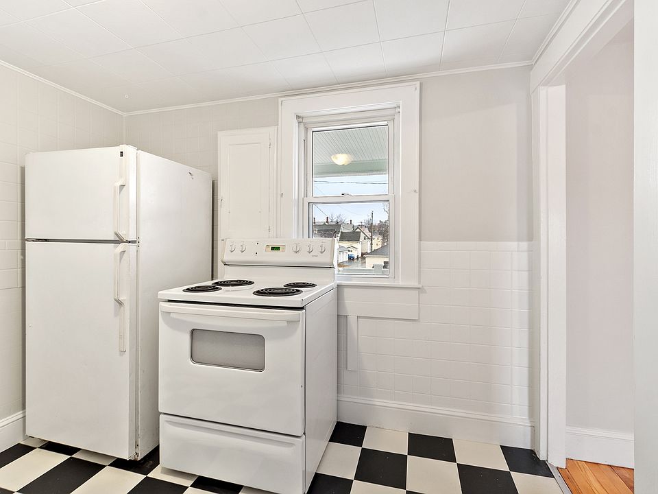 Kitchen with view outside to Chestnut street yard and neighborhood.