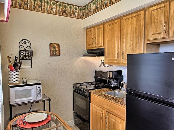 Full kitchen with microwave and oven