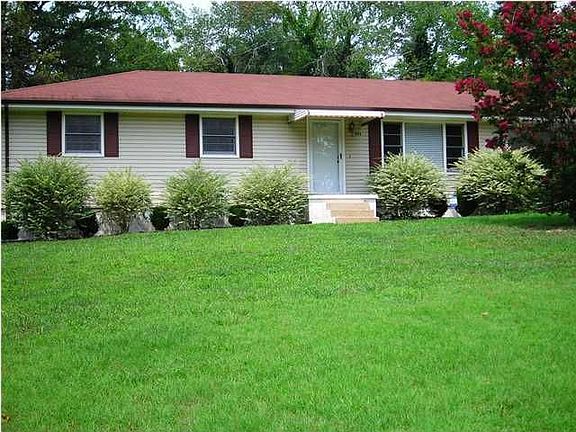 This home sits way back from the road and has tons of parking!