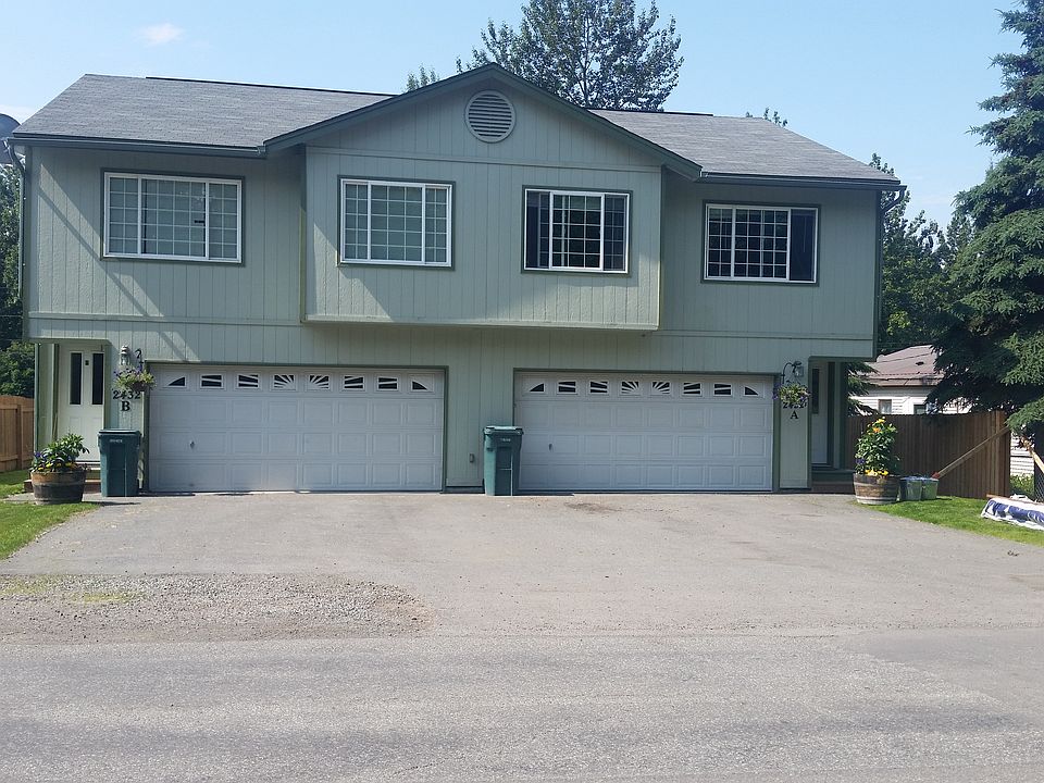Duplex from exterior, 2-car driveway parking each side plus