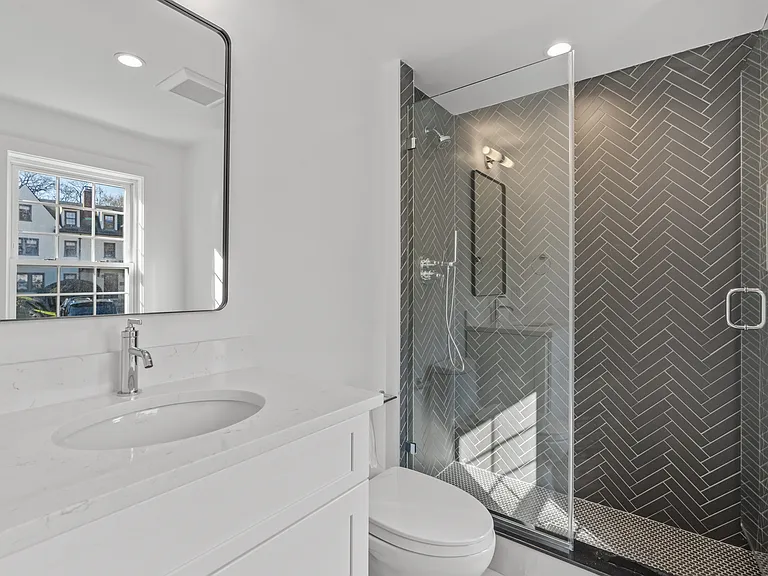 Front entry Powder room with stall shower.