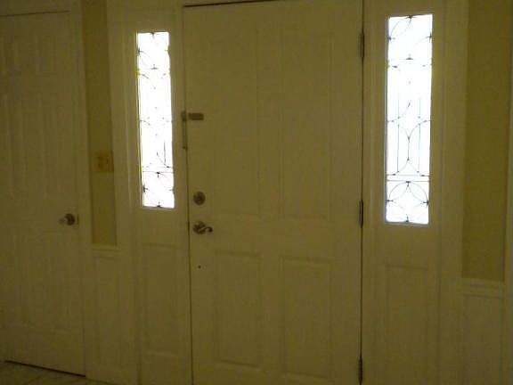 Front entry with marble flooring