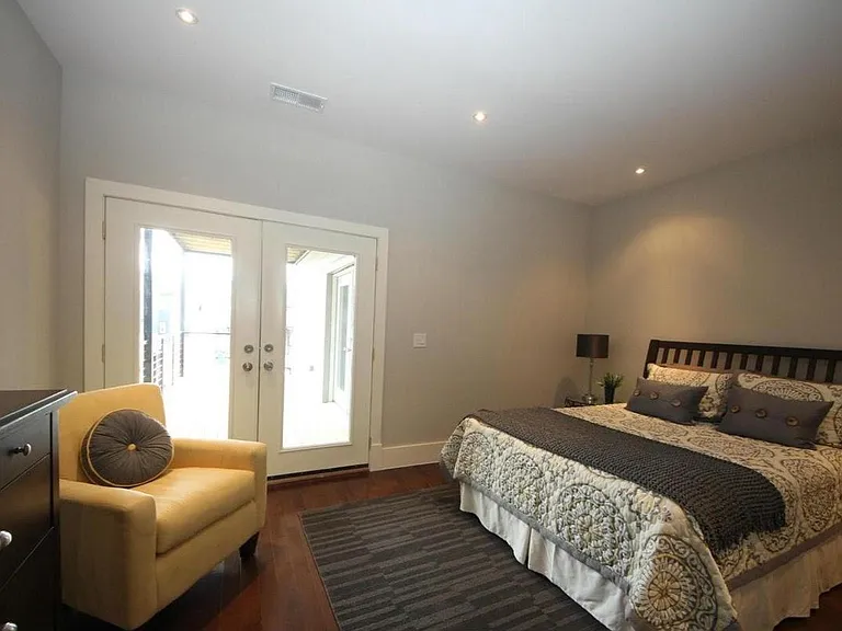 Spacious bedroom with walk-in closet and direct access to rear deck