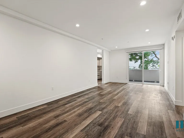 Open-Concept Living and Dining Room with Patio