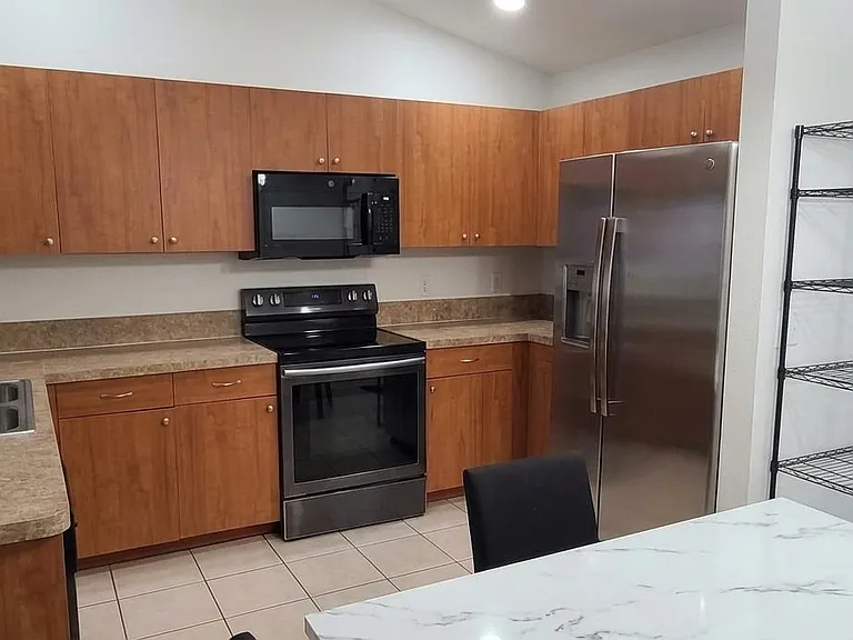 U-shaped kitchen with ample cabinet storage,