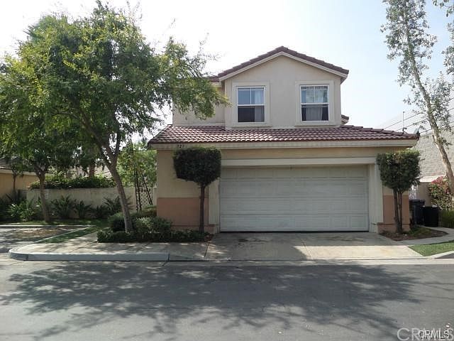 Front of house. 2 car garage access, garage parking only. Visitor parking just south of house.
