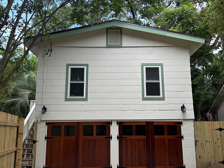 Set back from the street with a private garage space.