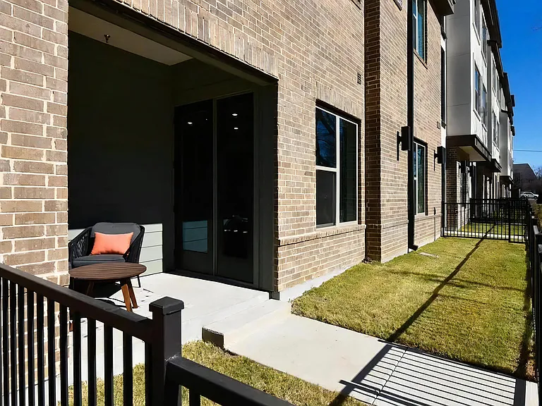 Ground-Level Patio with Fenced-In Green Space and Private Entry