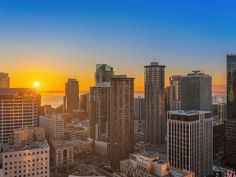 Twinkling city lights add to the west facing sunset views.