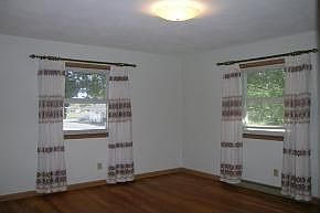 BEDROOMS FEATURE HARDWOOD FLOORS AND NATURAL LIGHT FROM WINDOW PLACEMENT