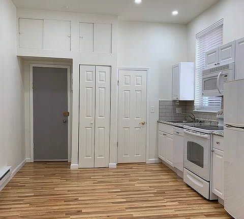 Kitchen Open Area - Entrance Door, Closet with Top Storage Space & LED Ceiling Lighting