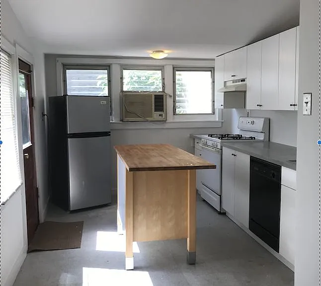 Kitchen has two rooms, this photo only shows one part - the other room before living room has room for a table