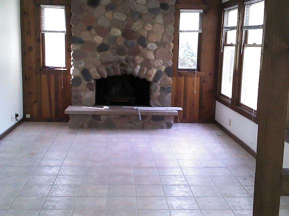 Stone fireplace in Den