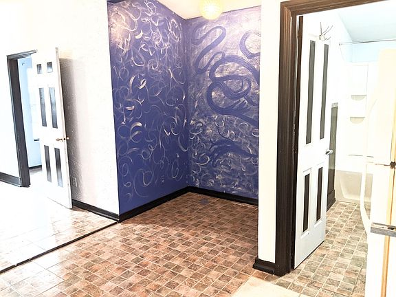 I'm standing by the oven to take the pic From the right side, door to bathroom, nook door, to bedroom