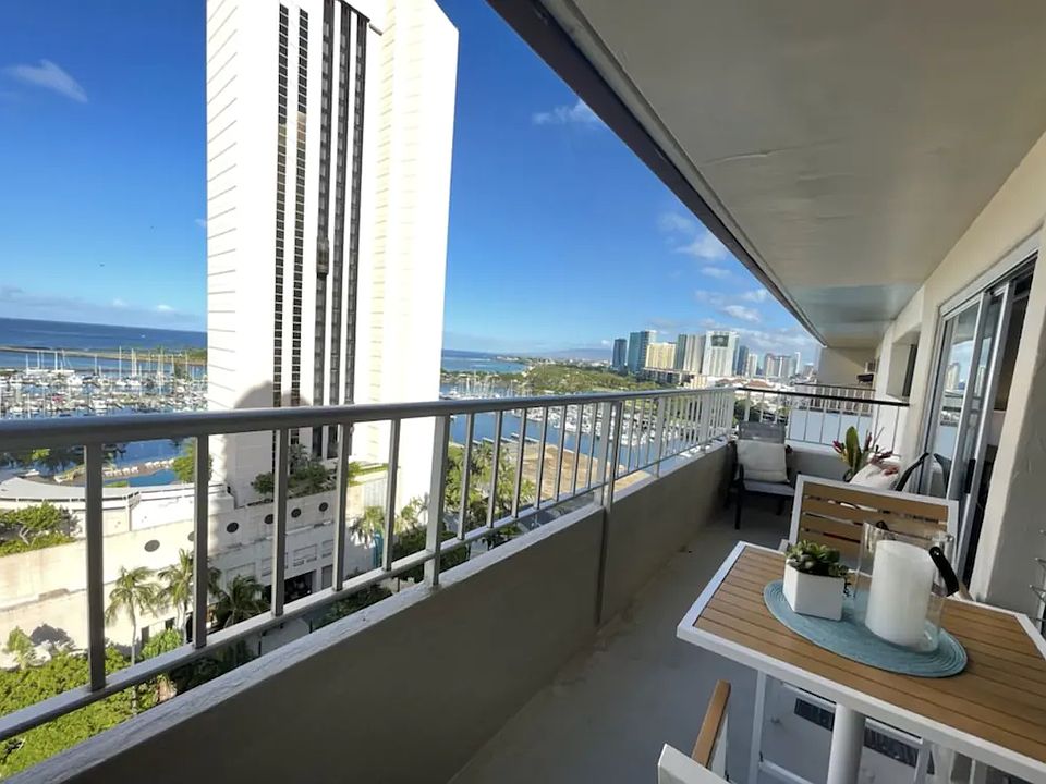 Bird's eye view of Ocean side Patio with Ala Moana Beach Park ! Patio dining table for breakfast and sunset meals!