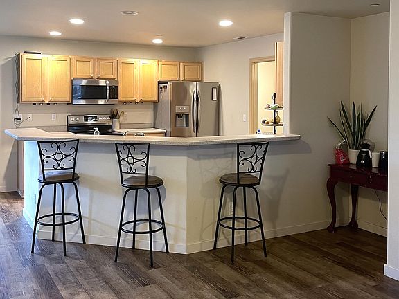 Kitchen with eat-in bar, room for 4-6 barstools! Plus a nook that is just perfect for a coffee bar!