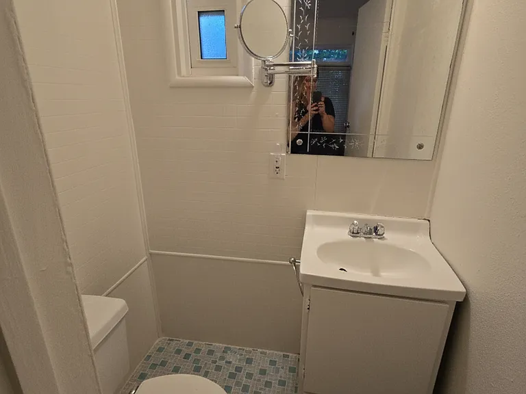 Half bath with door adjacent to the front main bedroom