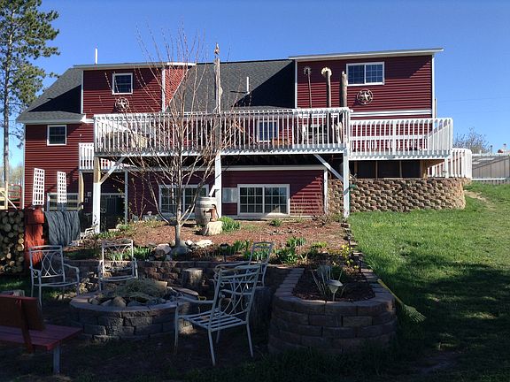 back of house with fire ring