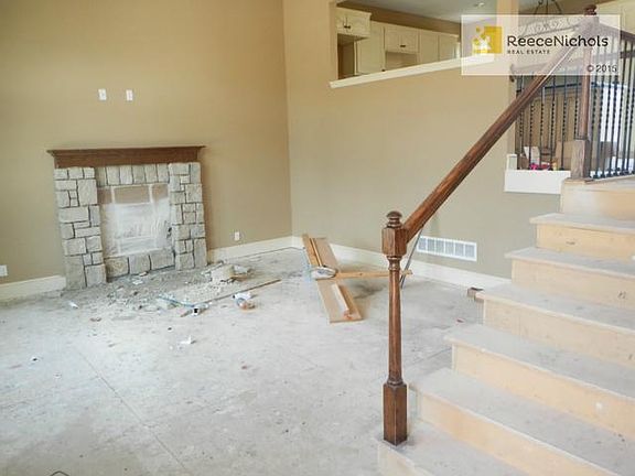 Your living room. Stoned fireplace with wood mantel.