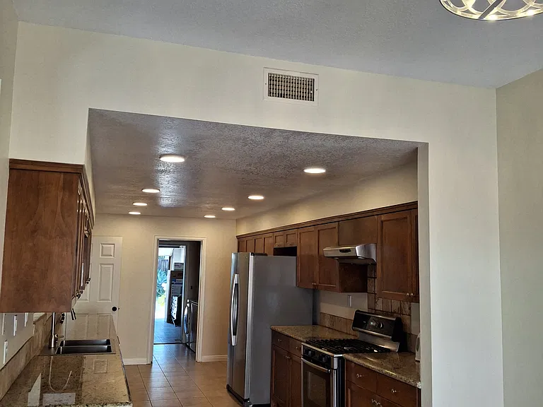 Kitchen with beautiful stone counters, new sink, new faucet, new dishwasher
