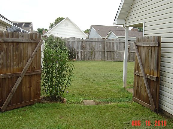 Use the double-doors to drive your boat or vehicle inside the privacy fence.