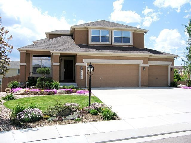 Stunning stucco 2 story in Pine Creek cul-de-sac w/ huge Pikes Peak views.