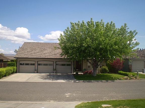 Front view with 3 car garage