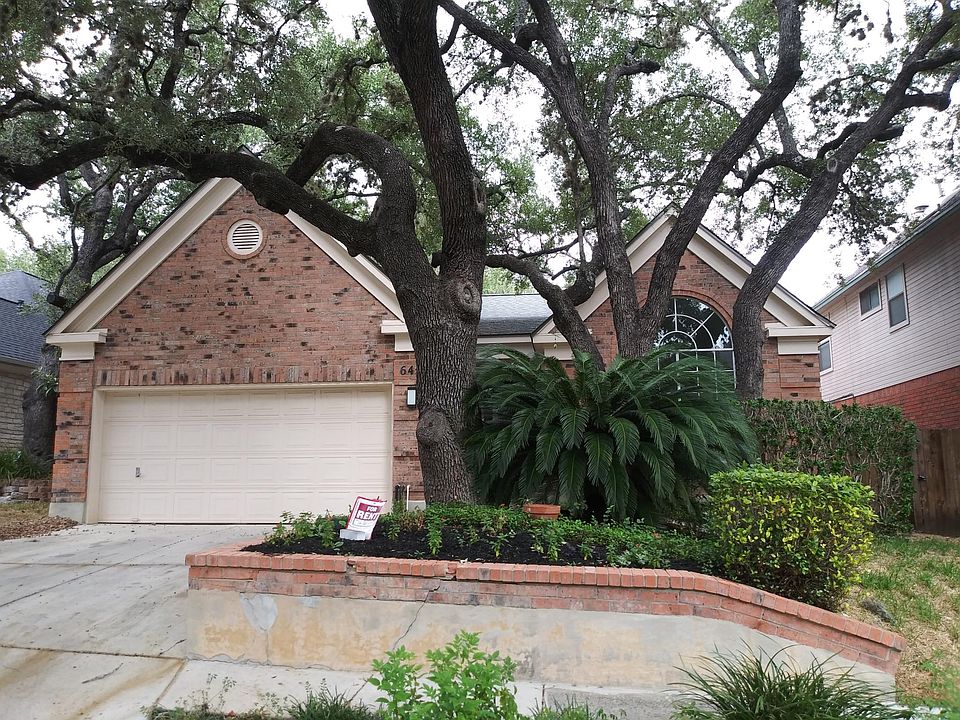 Mature trees provide shade, lower utility bills and beauty. Two car garage.