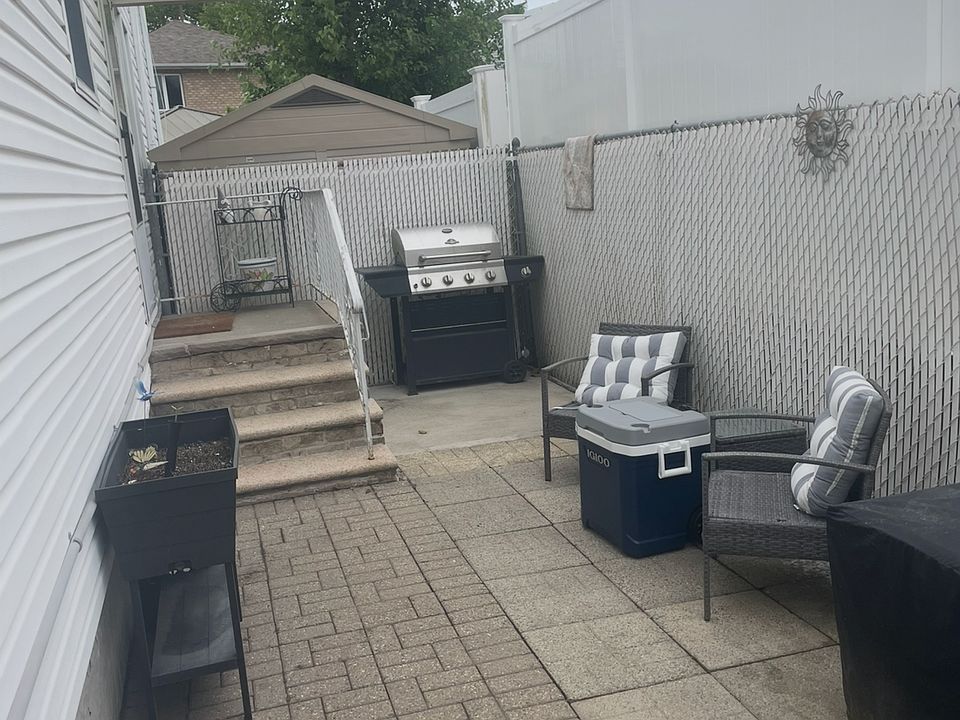 Entrance to Apt own gated side yard
w/ Bbq & seating area