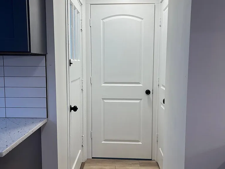 Doors to backyard/laundry/powder room