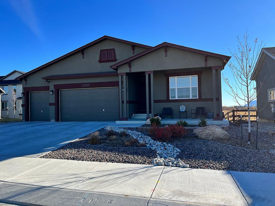 Front porch has views of a beautiful ranch and spacious 3 car garage with key code entry