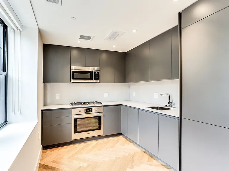 Studi apartment kitchen with European finished and hardwood floors