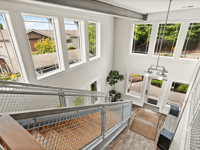 Bright, welcoming entryway with large windows and modern finishes.
