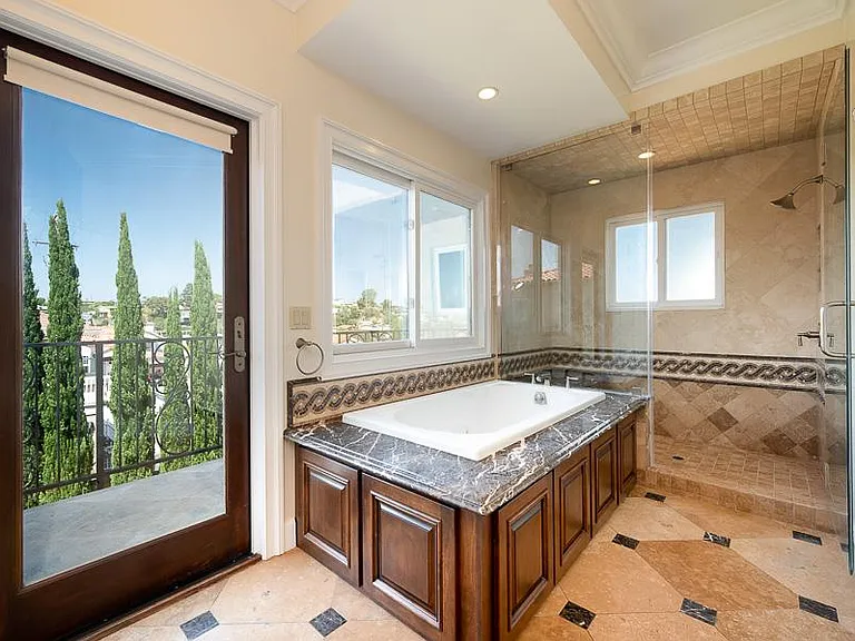 French door in Master bathroom with view Terrace.