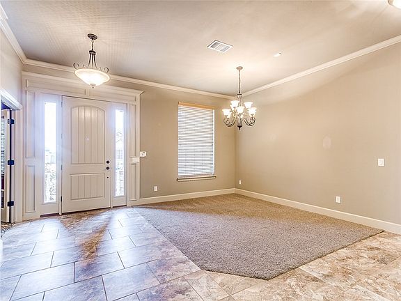 Bright, open large entry and formal dining area.  Office, optional living area or game room to the left of the entry.
