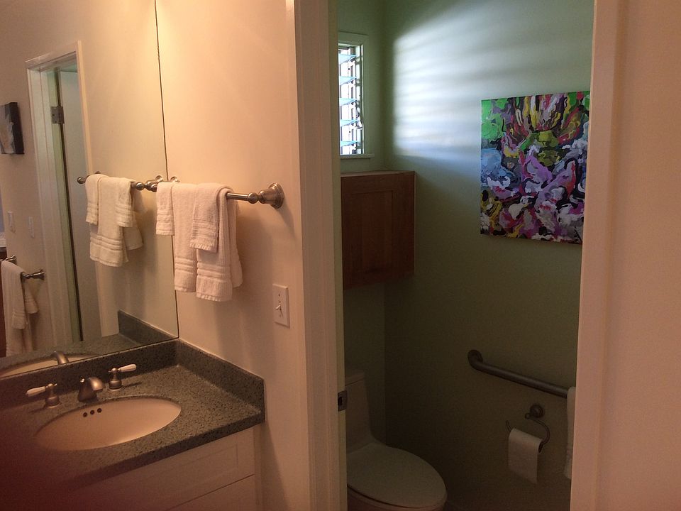 Vanity, partial view with private toilet
