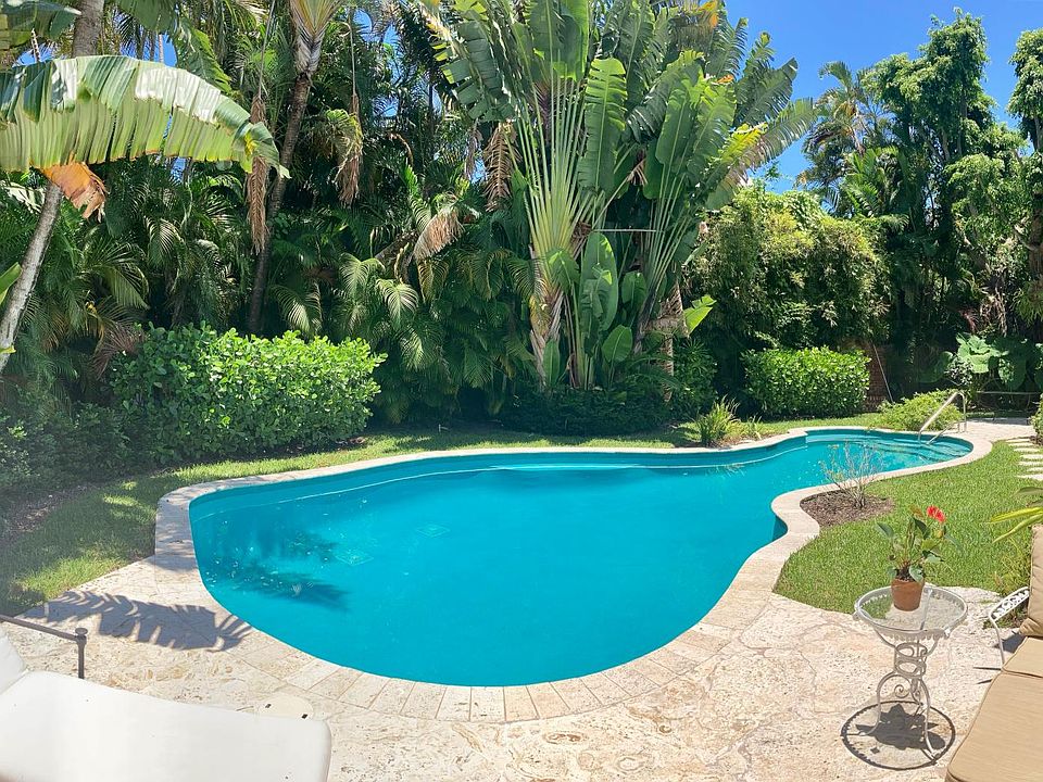 Enjoy the lush tropical pool & lounging patio, just outside your sitting room!