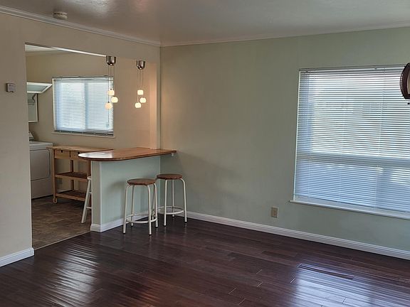 VIEW OF LIVING ROOM TOWARD KITCHEN