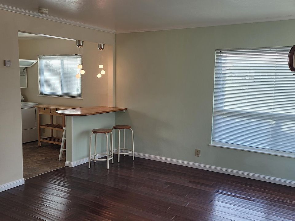 VIEW OF LIVING ROOM TOWARD KITCHEN
