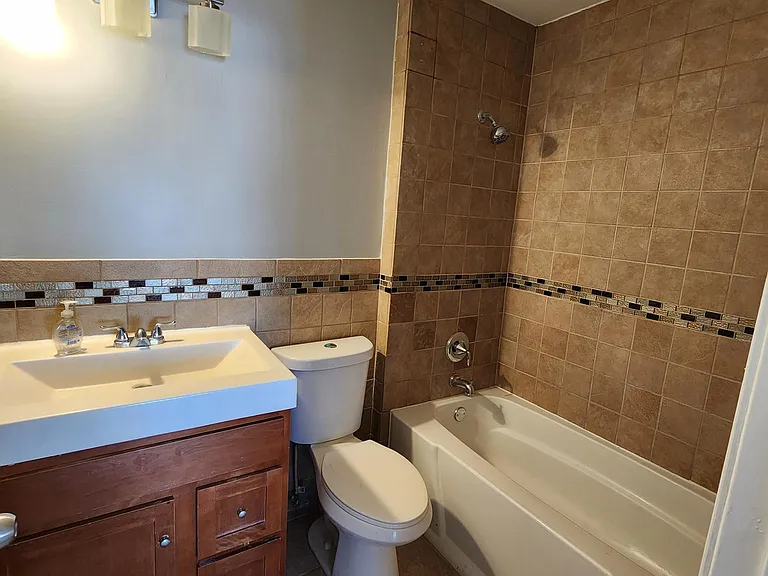 Second Floor: Hallway bathroom with full tub.