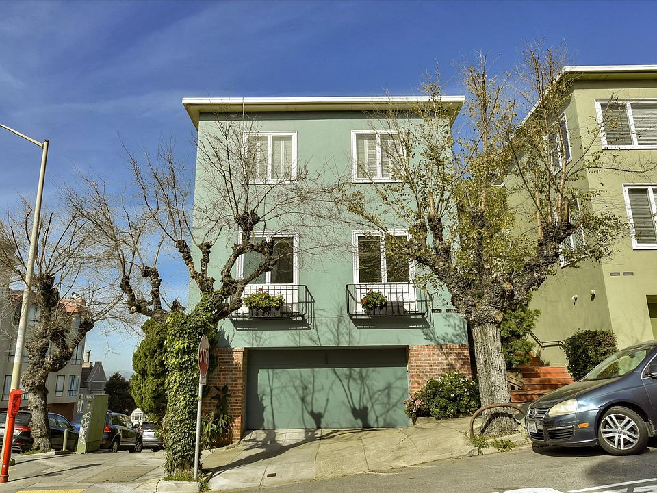 Street view. Flat is the entire second floor. Secure tandem parking for 2 vehicles included in rent