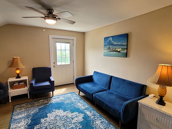 Living room with door to small outdoor balcony