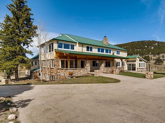 This original Hangen Ranch farmhouse is a signature Evergreen property.