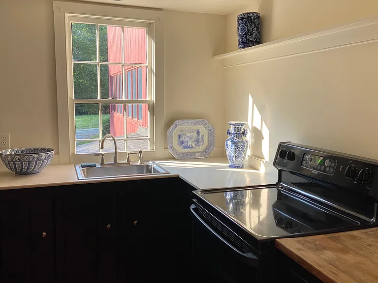 Second floor kitchen with Stainless appliances.