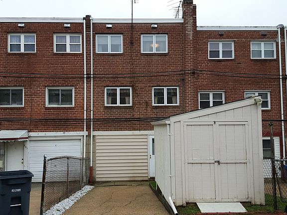 Back driveway with storage shed/ Rear entrance to basement