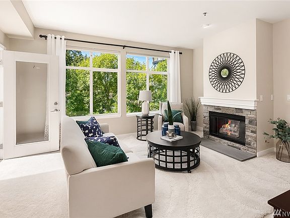 Gas fireplace, high ceilings, brand new paint and carpets.